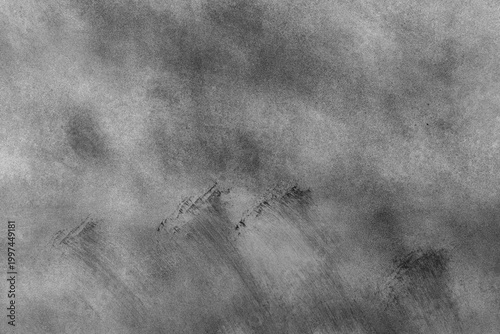 Subtle interplay of shadows on a soft gray iron background with some of soft brush strokes and grains