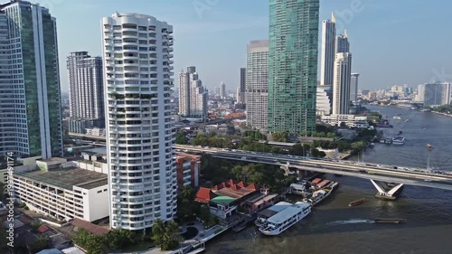 Aerial high view of skyscrapers in Bangkok city and Chao Phraya River, panorama 4k