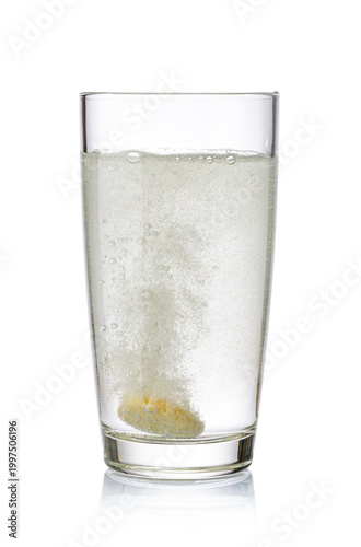 Effervescent tablet dissolving in a glass of water