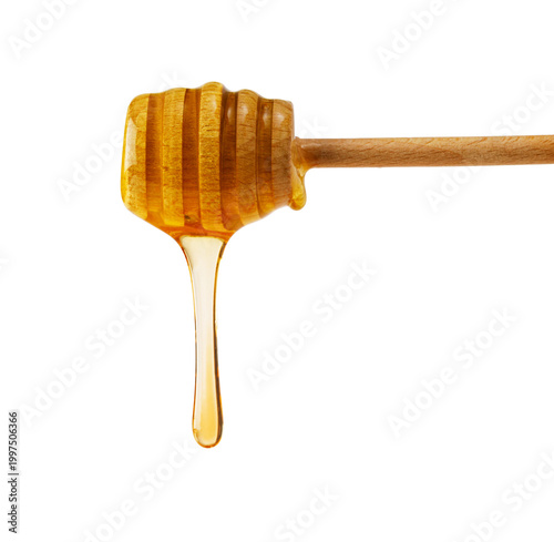Golden honey dripping from wooden dipper against transparent background