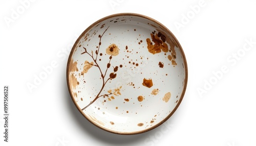 White ceramic plate with dirty food residue splatters
