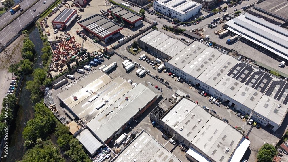 Fototapeta premium Drone aerial view of an industrial logistics cluster in San Giuliano Milanese, Italy.