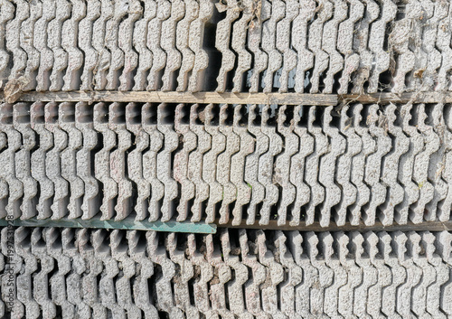 Old roof tiles arranged in rows, abstract background.
