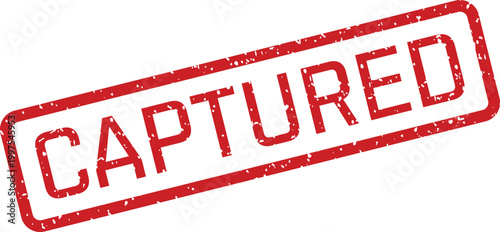 A vibrant grunge effect rectangular red rubber stamp prominently showing the word CAPTURED diagonally
