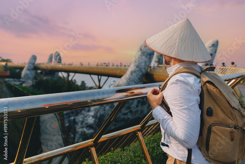 Man traveler tourist at golden bridge, ba na hills, Da nang, Vietnam sunset view
