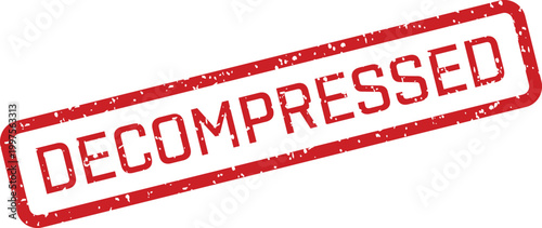 A bold red rubber stamp displaying the word DECOMPRESSED with a grunge texture on a white surface