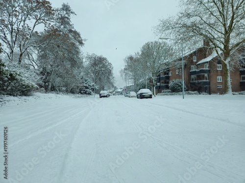 Urban winter scene. road covered with snow. Scenic image of spruces trees. Winter landscape - wooden house in snowy forest. Vertical photo. wooden bridge covered with snow.