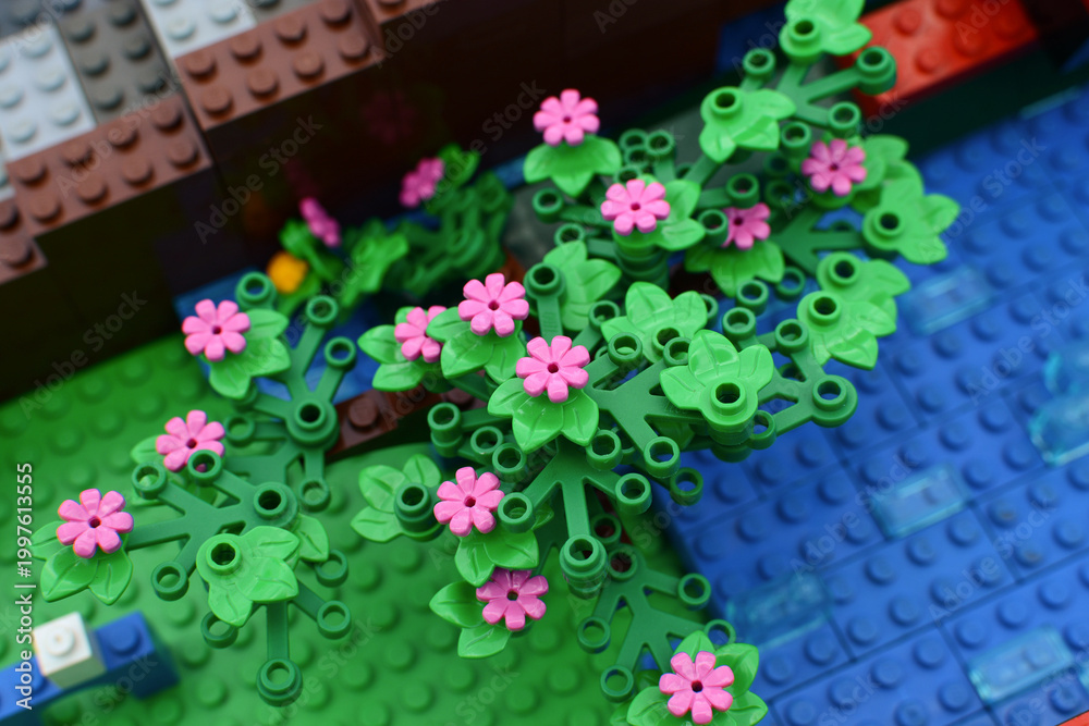 Obraz premium A floral background made of colorful Lego bricks. Lego flowers