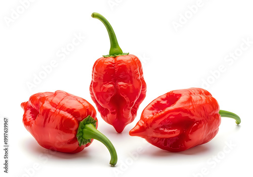 Three red hot peppers