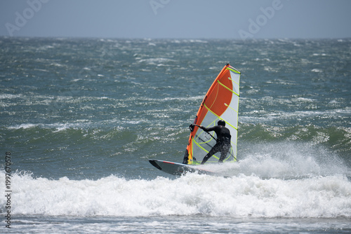 Fotografía Windsurfer on the ocean on a very windy day