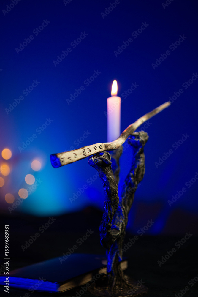 Fototapeta premium Magic wand on a stand near a candle