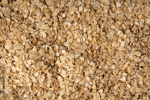 Tableau sur toile Oat flakes textured pattern, rolled oatmeal macro background