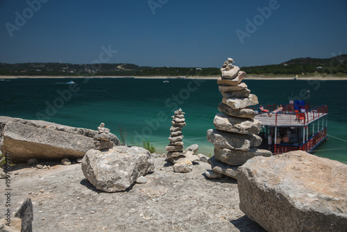 Canvas Print Stacks of Balanced Rocks  with Lake 
 behind them for  Good  Luck during party B