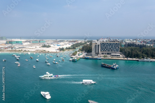 Canvas Print Aerial cityscape of Male Maldives showing crowded harbor, boats and expanding ar