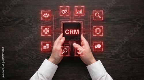Modern Businessman Managing CRM System via Smartphone and Holograms