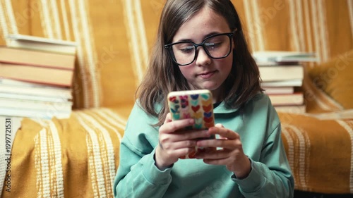 Little Girl in Glasses Talking on Video Call via Smartphone, Child Using Mobile Phone for Online Chat, 4K 10-bit