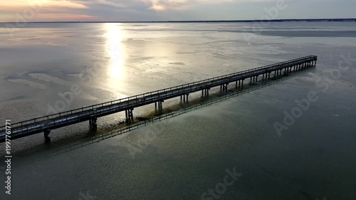 Drone Clip orbiting on frozen bay in winter on the Jersey Shore Cloudy Day