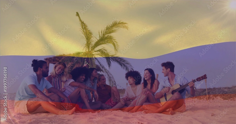 Fototapeta premium Chatting 8 friends lounging on blanket by palm tree with lights, in summer wear, acoustic guitar