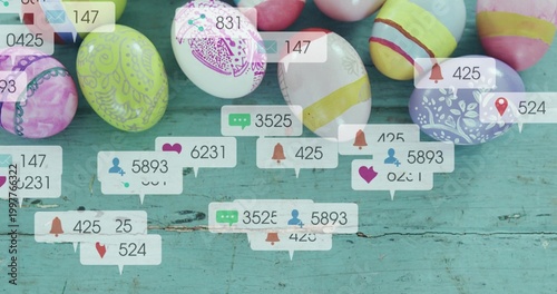 Showing cluster of decorated Easter eggs sitting on worn turquoise table, with notification bubbles
