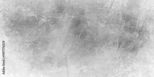 Vintage dark gray concrete wall with a rough textured grunge pattern and aged black and white paper design for an abstract backdrop