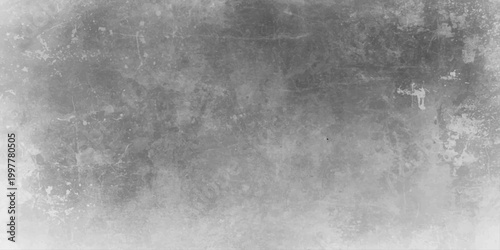 A dark aged black and white grunge wall background featuring a rough textured concrete surface with a vintage gray stone pattern and old dirty paper art design