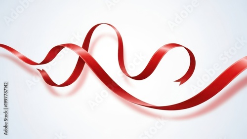 Red ribbon swirling on plain background