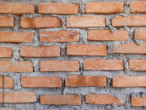 Rustic brick wall with visible mortar joints
