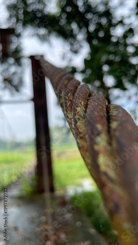 Close Up of Rusty Steel Cable Outdoors Showing Corrosion Texture and Weathered Industrial Detail