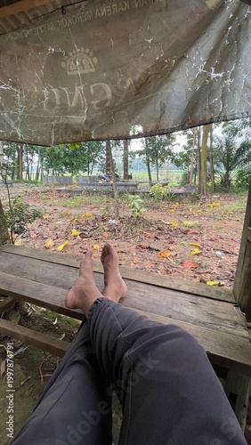 POV Relaxing Outdoors Under a Canopy with Calm Nature View and Peaceful Atmosphere