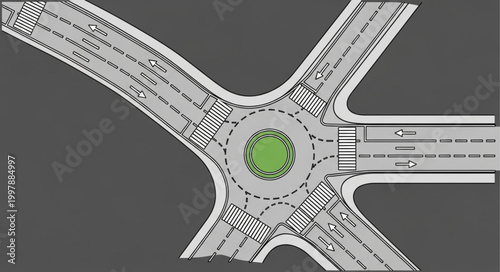Aerial view of a modern roundabout intersection with traffic lanes.