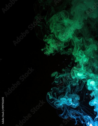 Vibrant green and blue smoke swirling mysteriously in the dark, forming soft, ethereal clouds against a deep black background