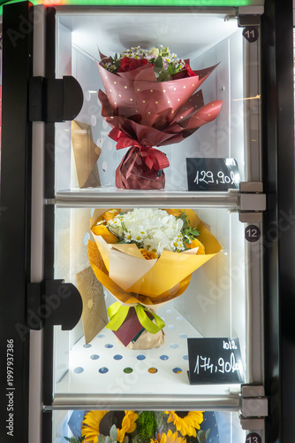Cluj-Napoca, Romania Fresh flower bouquets for sale in a dispenser with prices in Lei, Romanian currency.