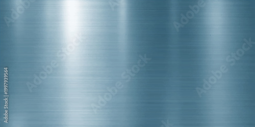Industrial silver stainless steel plate with a polished brushed metal texture on a shiny grey aluminum surface