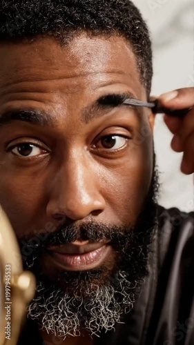 Black Man Grooming Eyebrows with Brush Close Up