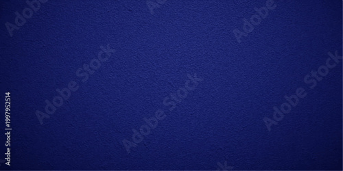 Dark blue vintage fabric texture background featuring a grunge textile material design with a rough aged canvas surface for a textured wallpaper backdrop