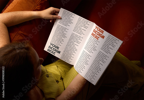 Mockup of female hands holding an open magazine with 2 pages