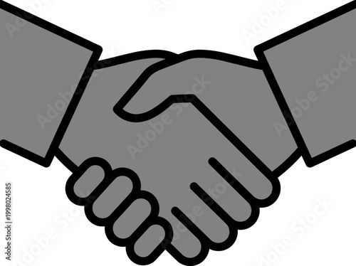 Two people shake hands in a formal business agreement meeting