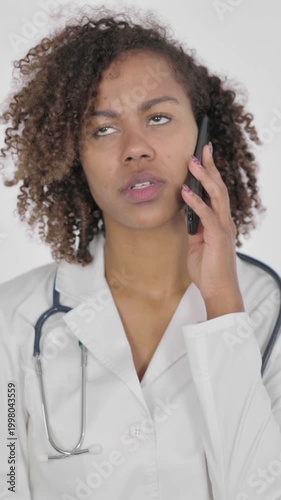 African Female Doctor Talking on Phone on White Background, Vertical Video