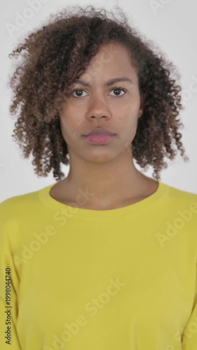 Young African Woman Feeling Shocked on White Background, Vertical Video