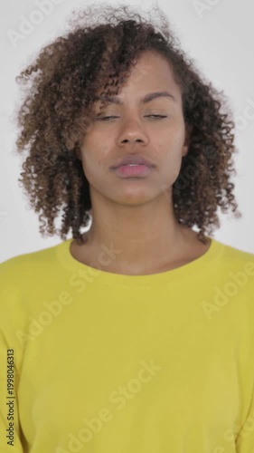 Young African Woman Pointing at Camera, Inviting on White Background , Vertical Video