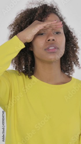 Young African Woman Looking Around, Searching White Screen , Vertical Video