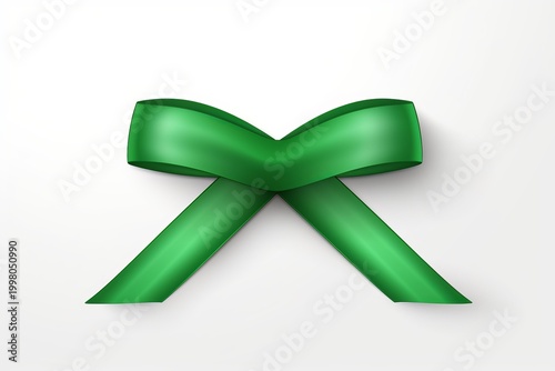 Green satin ribbon forming a bow, resting on a clean white surface with subtle shadow