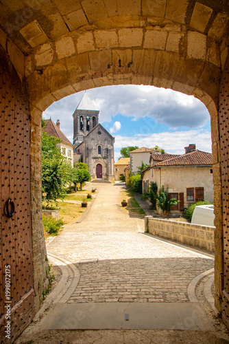 View of Bourdeilles village through the medieval castle gate, Dordogne, France