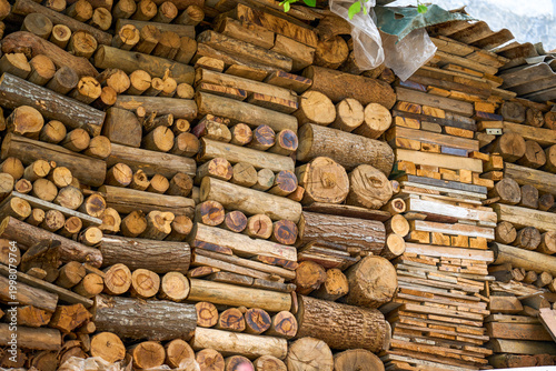 Pile of steaming firewood beside a house in rural China