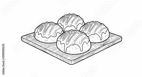 Four round pastries with drizzled icing and sprinkles on a wooden board