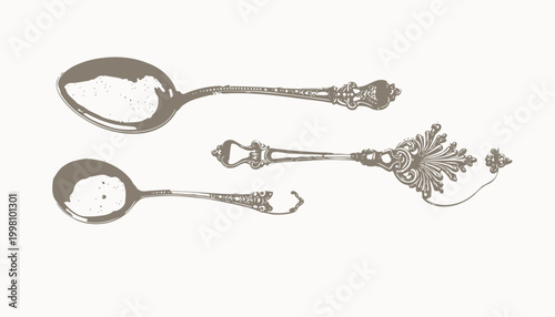 Intricately Designed Silver Cutlery Set Displaying Elegant Vintage Patterns and Carved Details in Both Spoon and Knife with a Refined Antique Aesthetic