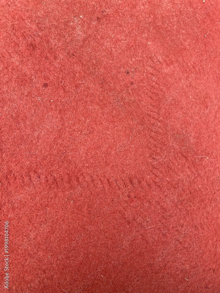 Fototapeta premium Vibrant red felt texture backdrop featuring subtle woven fabric detail and soft organic fibers for minimalist design projects and artistic creative backgrounds