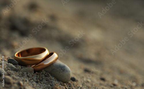wedding rings on the sand. Wedding couple rings. Love concept. Photo. Background. Romance. Dream. Life