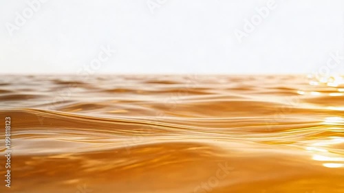 Golden liquid surface with ripples