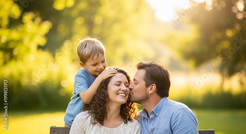 Happy mother receiving love from husband and son in sunlit park, celebrating Mother's Day, affectionate family portrait, warm sunset glow, togetherness and parenting concept.